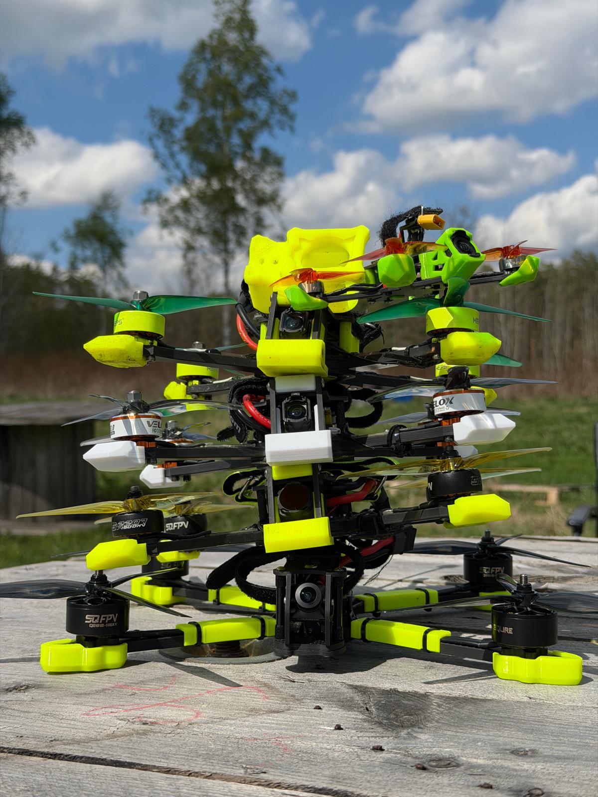 FPV drones stacked in a tower at Polygon X
